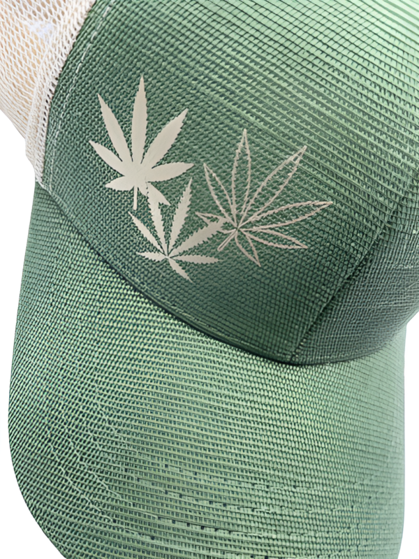 Close up of green snapback hemp hat and three gold cannabis leaf design