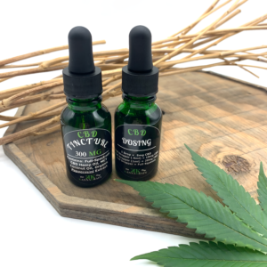 Full Spectrum Premium Maine-Grown CBD tincture bottles, showing the labeling on front and back with amount and dosing