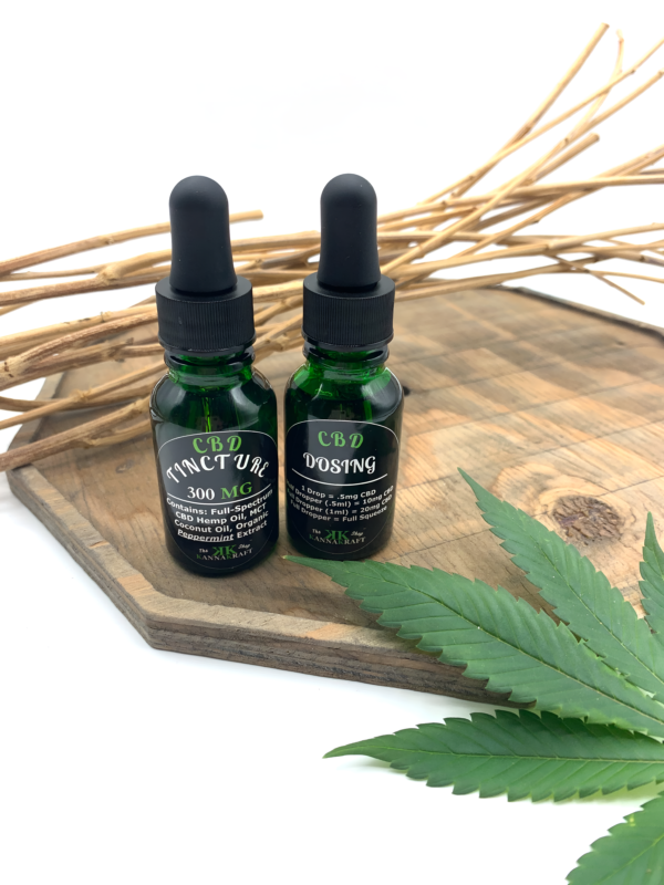 Full Spectrum Premium Maine-Grown CBD tincture bottles, showing the labeling on front and back with amount and dosing